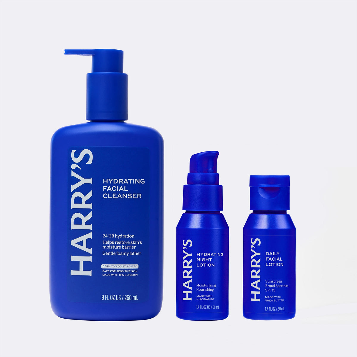 Set of Harry's skincare products including cleanser, night lotion, and facial lotion on a light gray background.