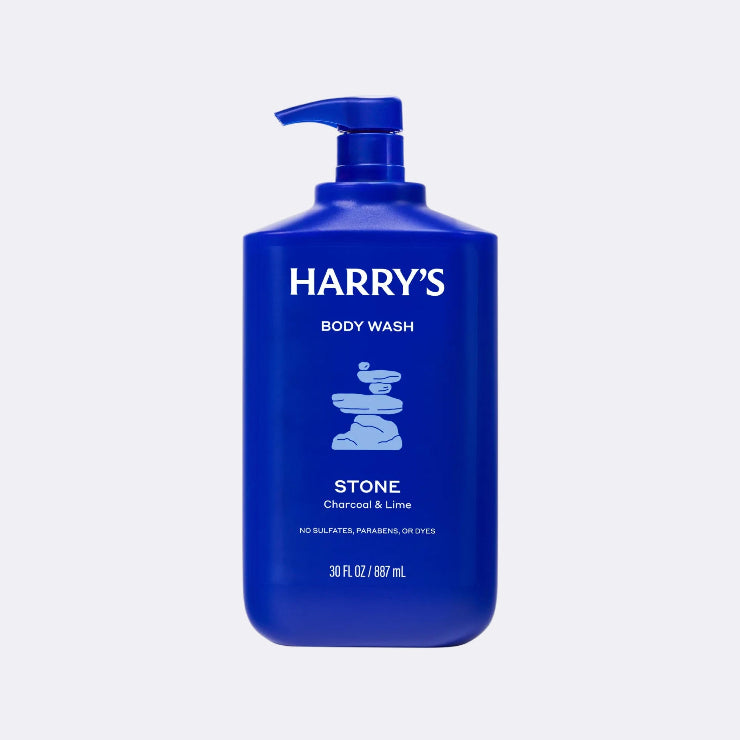 Blue bottle of Harry's body wash on a light gray background