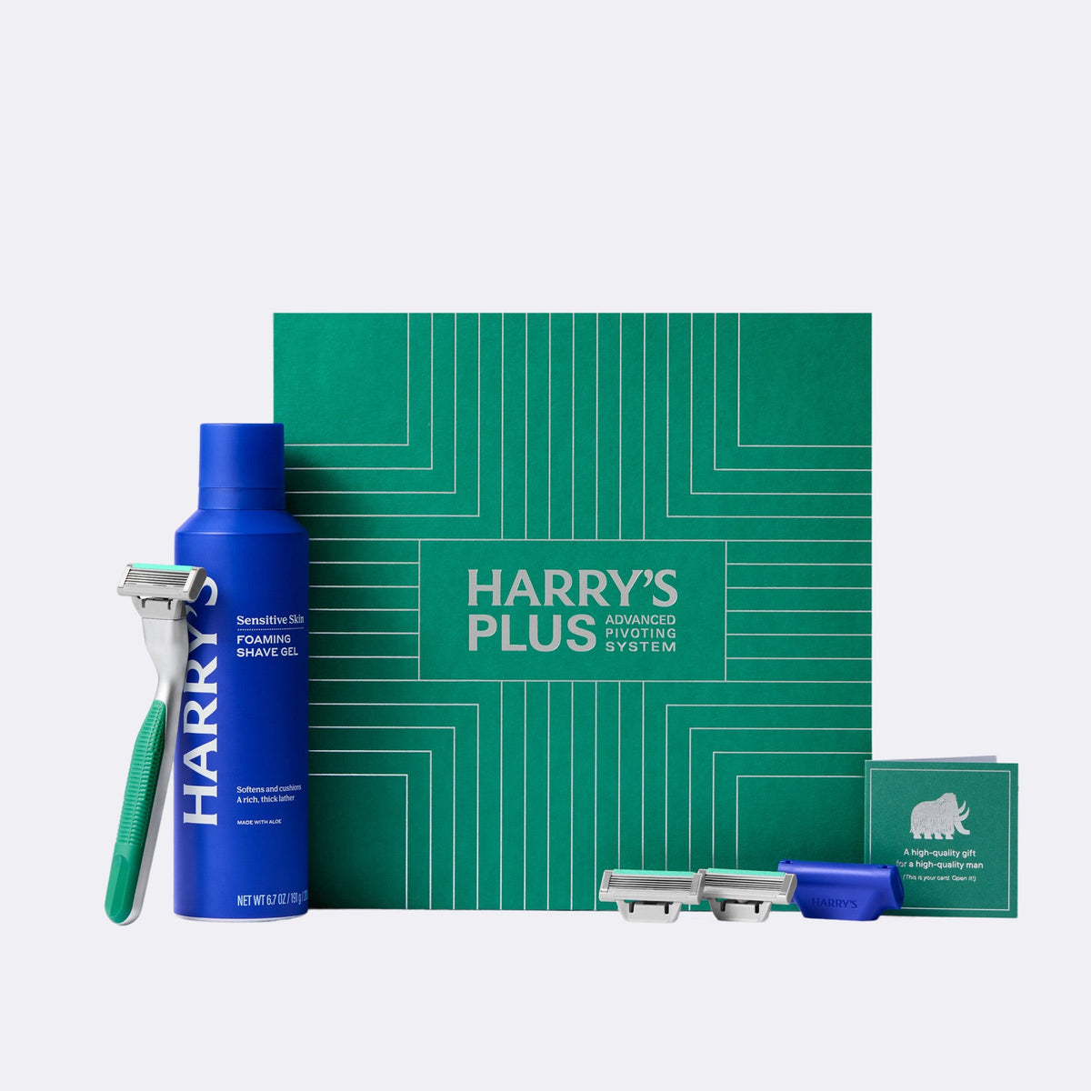 Harry's shaving product set with blue bottle, razor, and green box on a white background