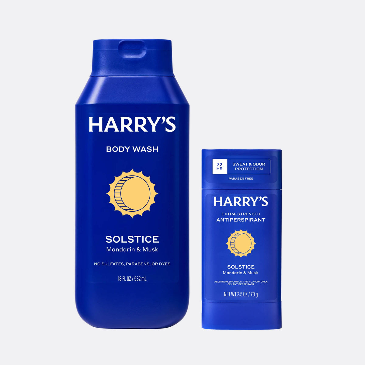 Two blue bottles of Harry's body wash and antiperspirant on a light gray background