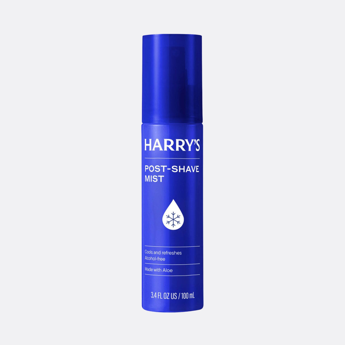 Blue bottle of Harry's post-shave mist on a light gray background