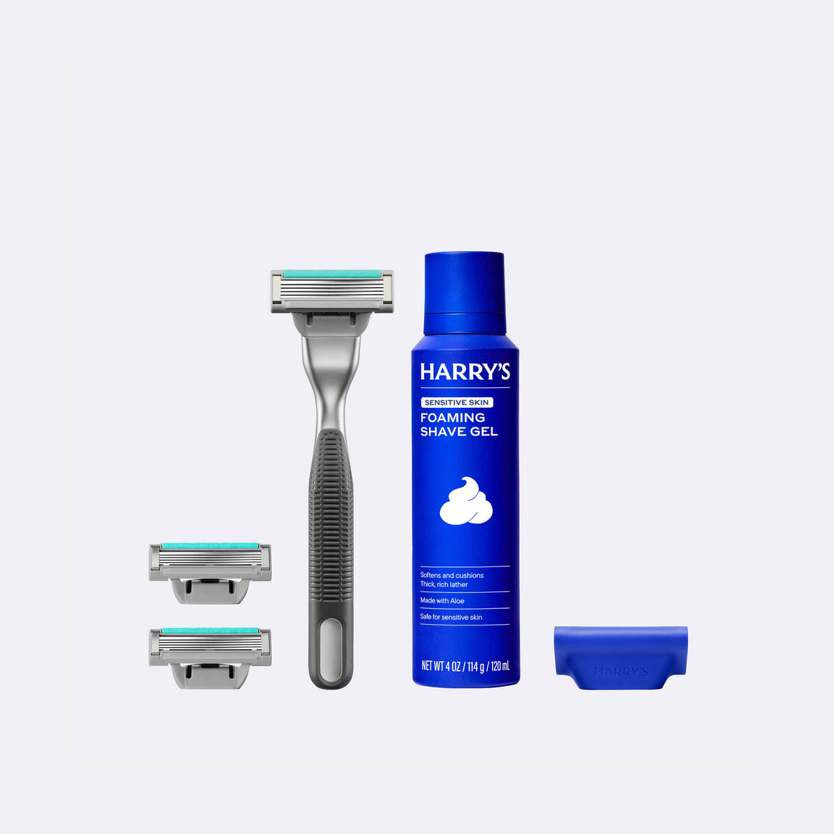 Harry's shaving kit with razor, shaver heads, and foaming shave gel on a white background