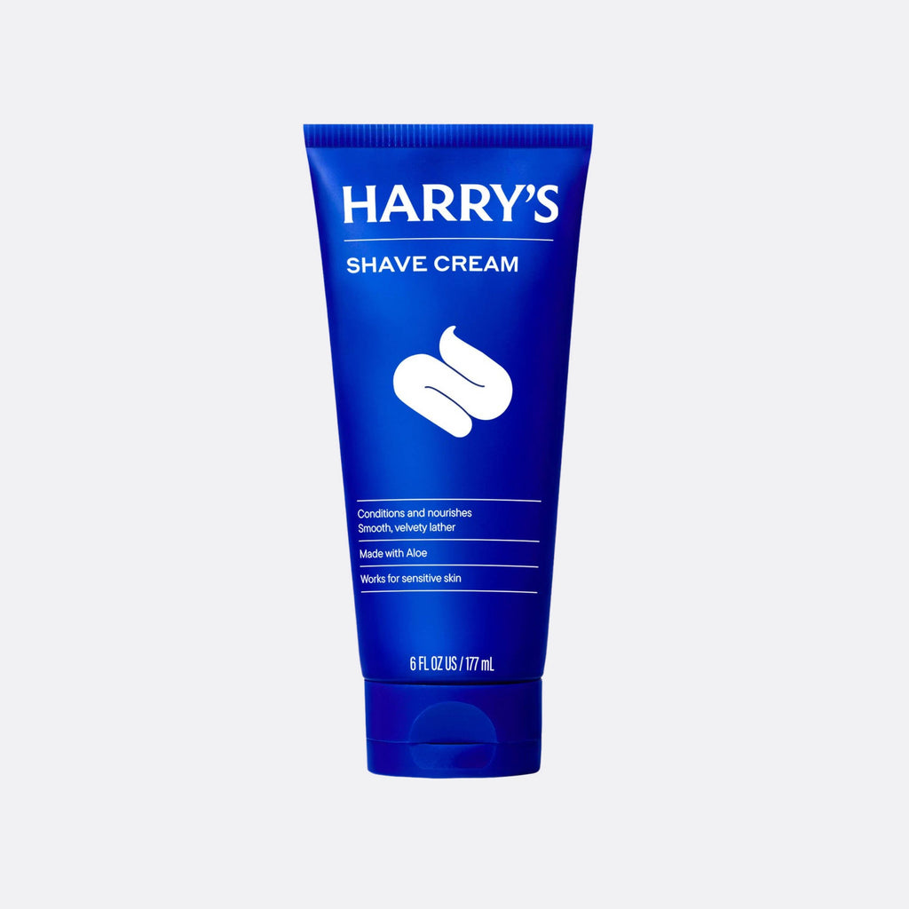 Blue tube of Harry's Shave Cream on a light gray background