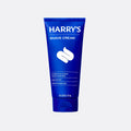 Blue tube of Harry's Shave Cream on a light gray background