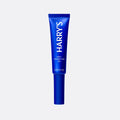 Blue tube of Harry's spot correcting gel on a light gray background