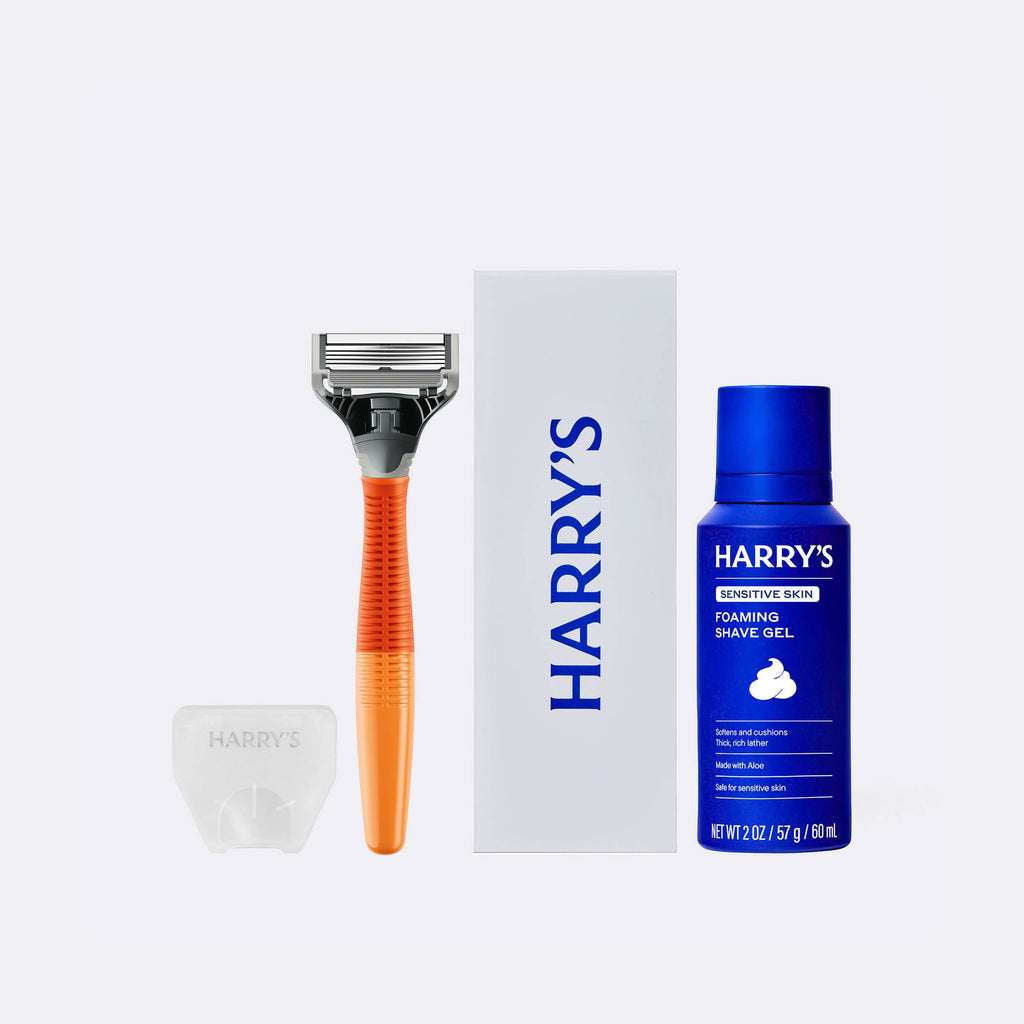 Harry's shaving kit with razor, box, and shave gel on a white background