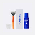 Harry's shaving kit with razor, box, and shave gel on a white background
