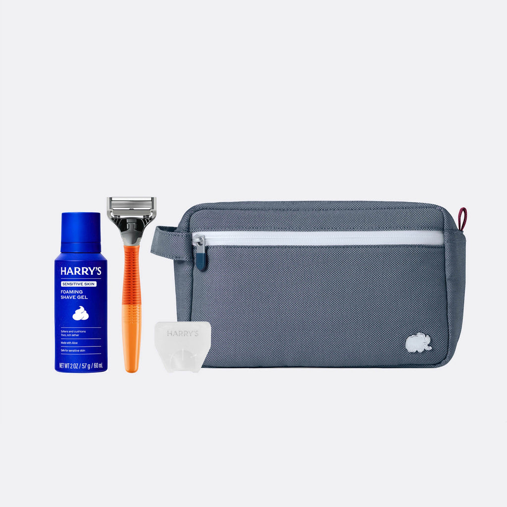 Shaving kit with Harry's shaving gel, razor, and pouch on a white background