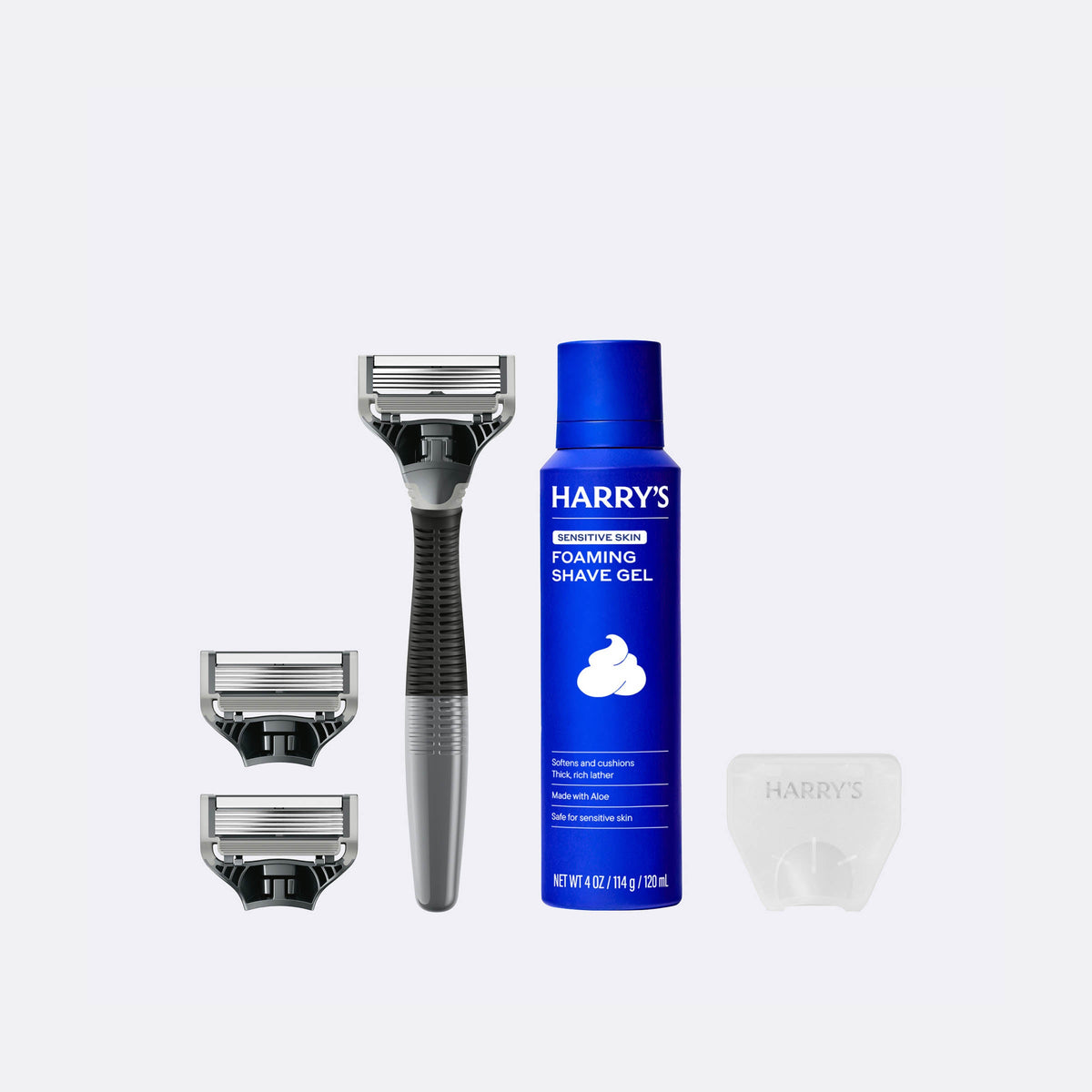 Harry's shaving kit with a razor, shaver head, and foaming shave gel on a white background
