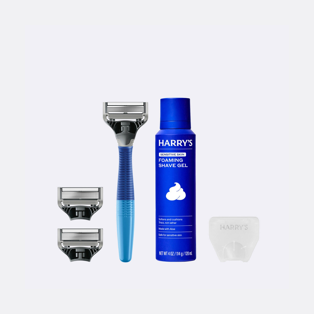 Harry's shaving product set including a razor, shaver head, and foaming shave gel on a white background