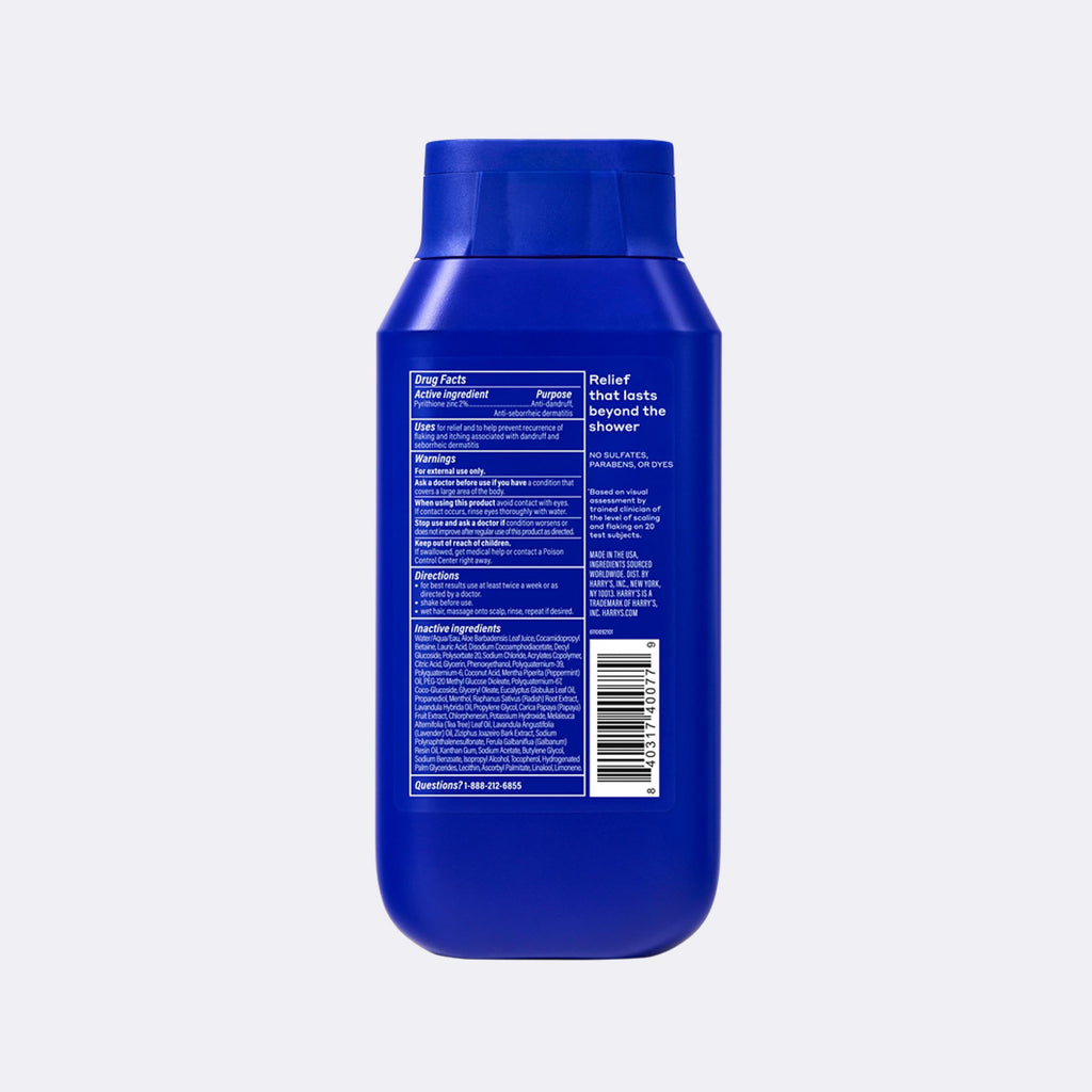 Blue bottle with label on a light gray background