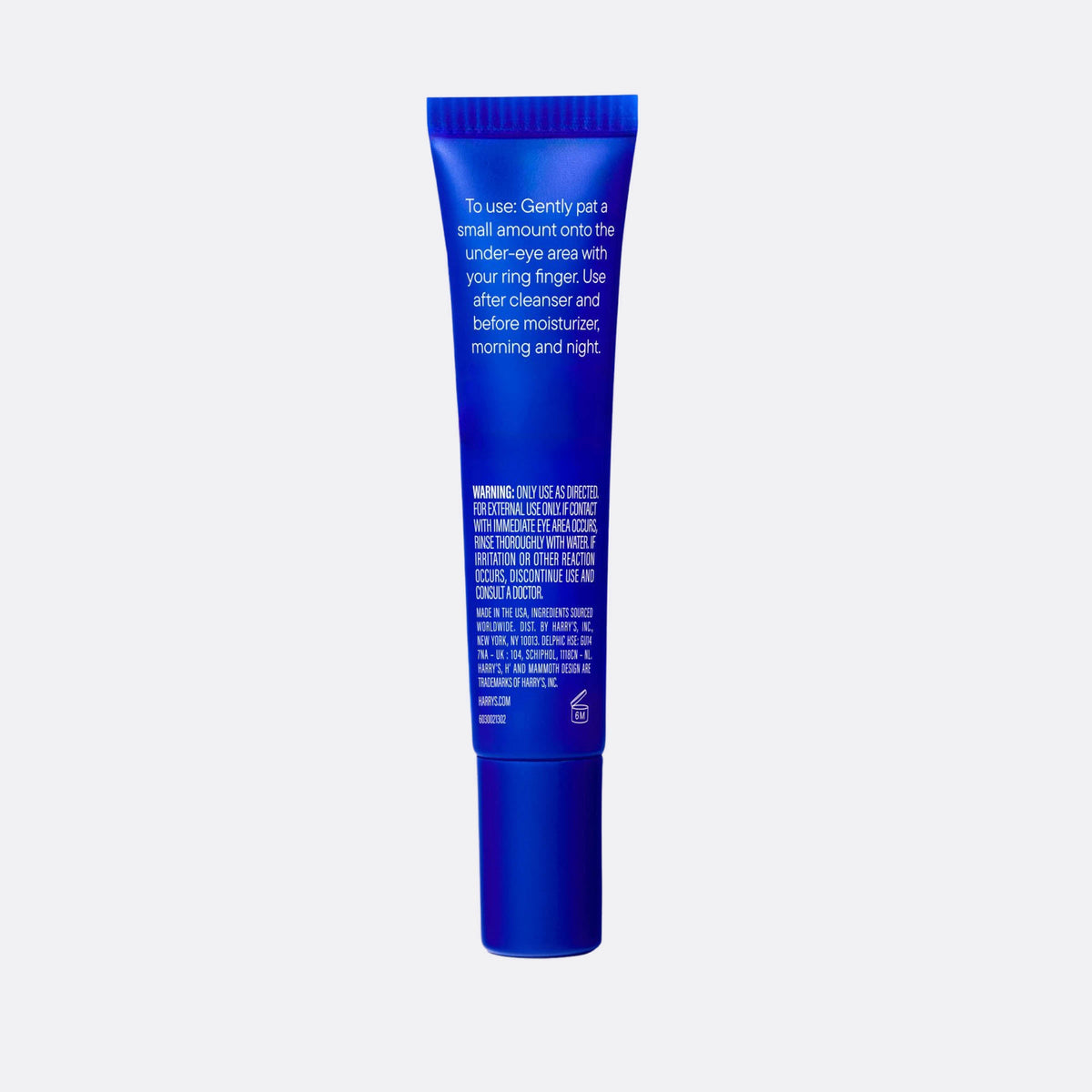 Blue eye cream tube with text on a white background
