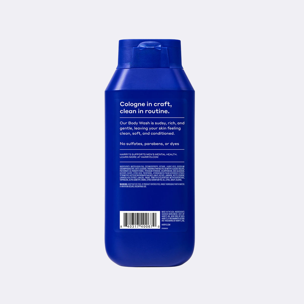 A blue plastic bottle of Cologne in Craft body wash, shown from the back against a light gray background.