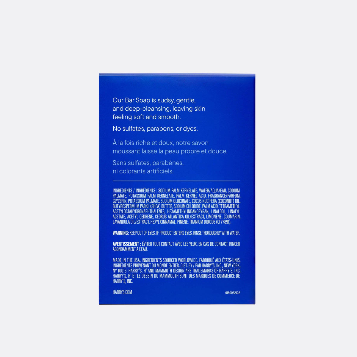 The back of a blue rectangular bar soap box by Harry's, featuring product details in English and French text on a light gray background.