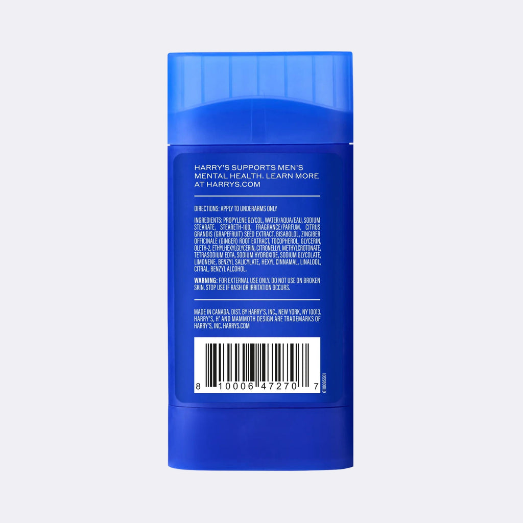 Blue cylindrical deodorant container with text and a barcode on a light gray background