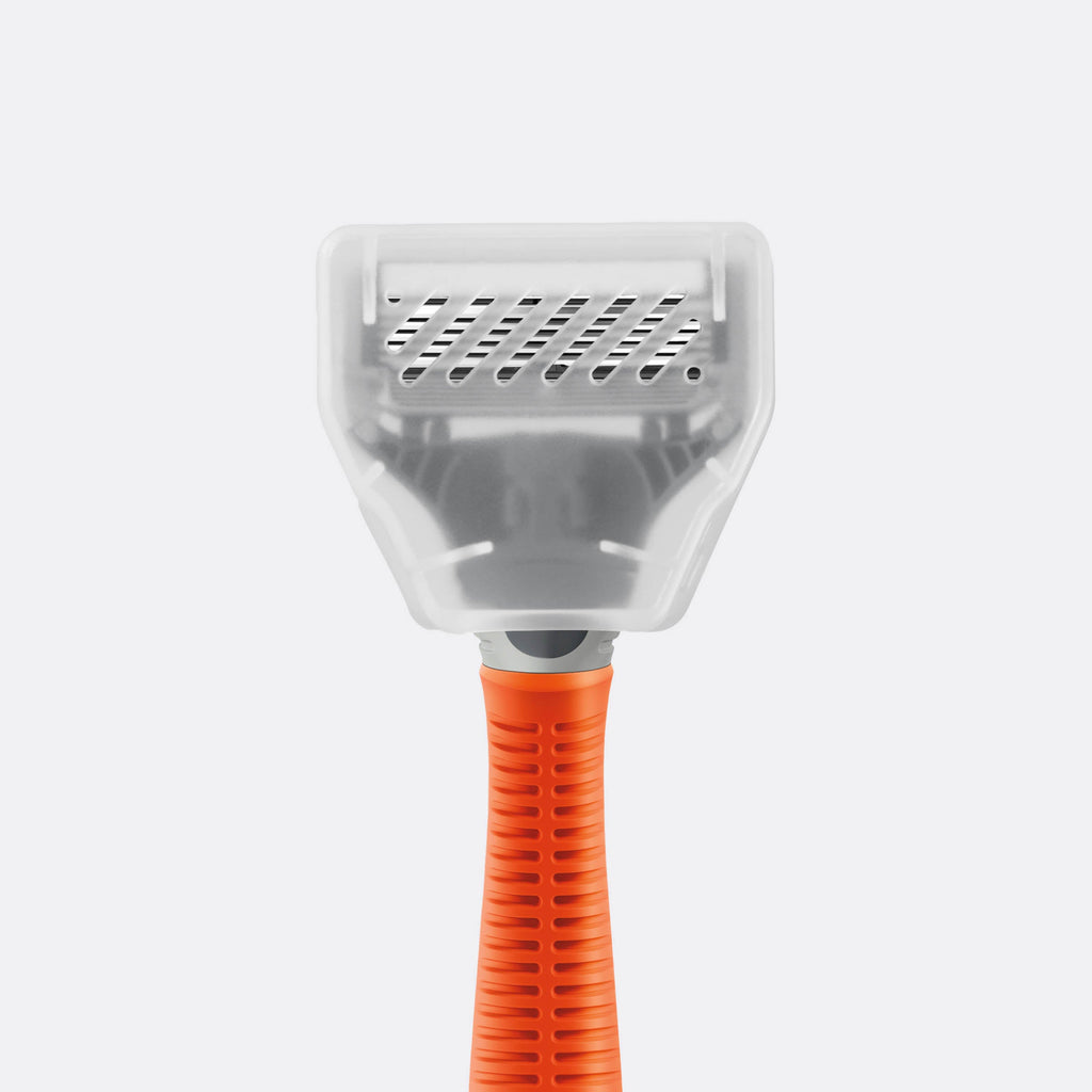 Cat litter scoop with orange handle on a white background