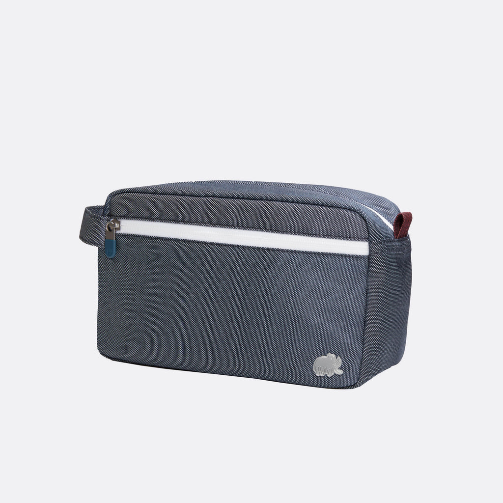 Gray toiletry bag with a white stripe on a light gray background