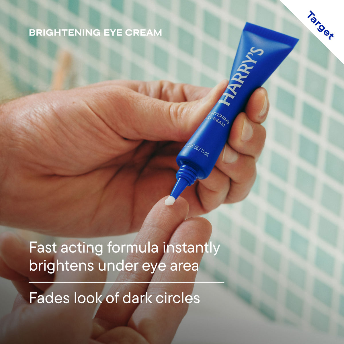 Hand holding a blue tube of Harry's brightening eye cream with text about its benefits.