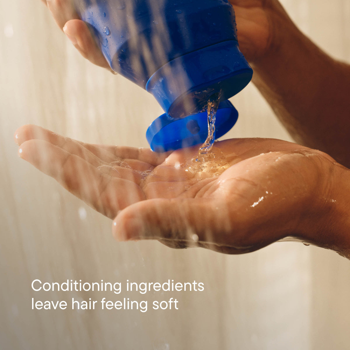 Hand squeezing product into palm with text "Conditioning ingredients leave hair feeling soft"