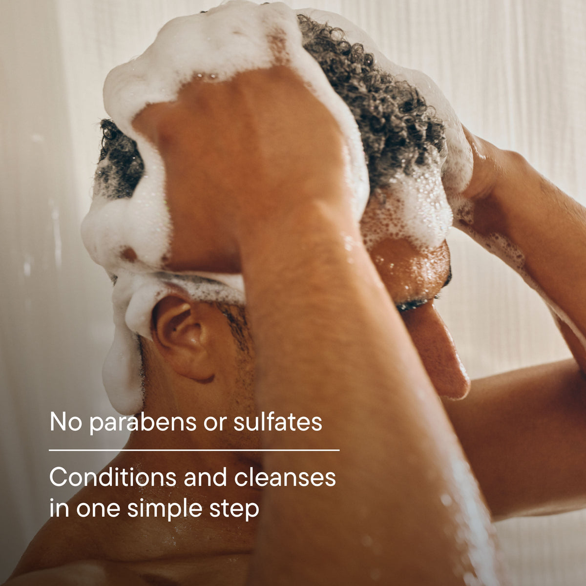 Person washing hair with a towel, with text about product benefits.