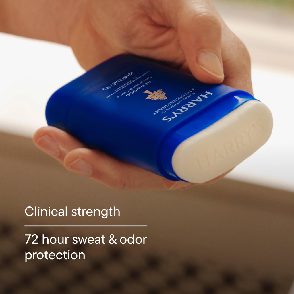 Hand holding a blue deodorant stick with 'Harrys' branding, labeled as clinical strength with 72-hour protection.