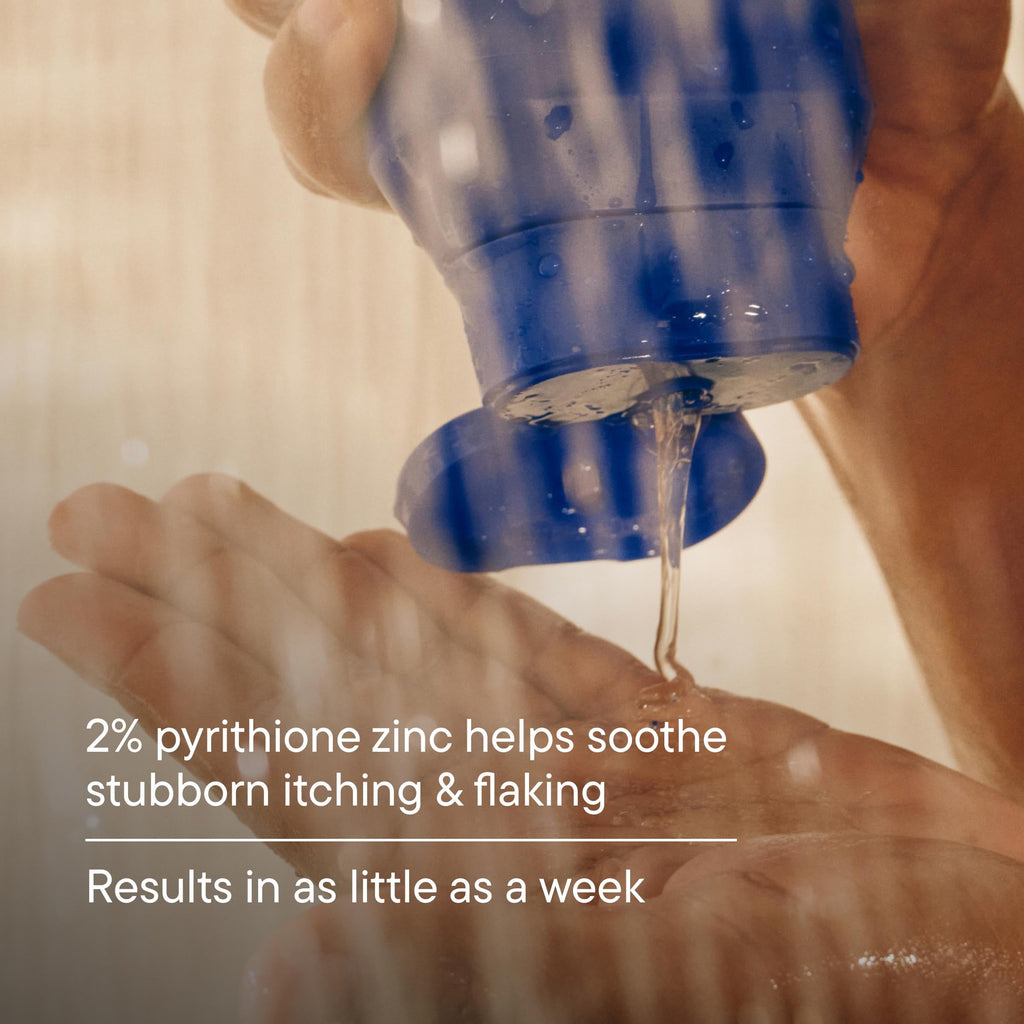 Hand applying a blue bottle of skincare product to another hand with text about pyrithione zinc.