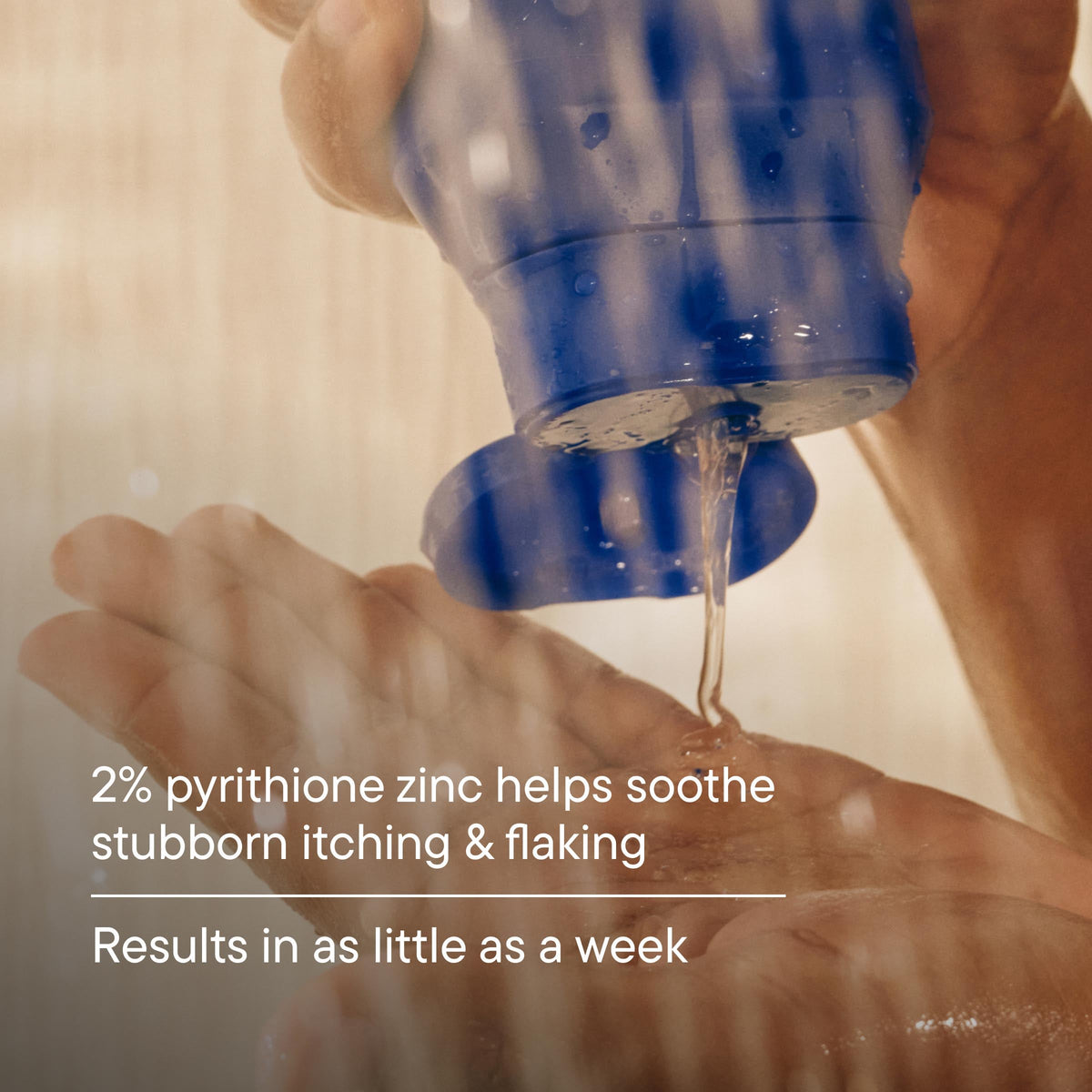 Hand applying a blue bottle of skincare product to another hand with text about pyrithione zinc.