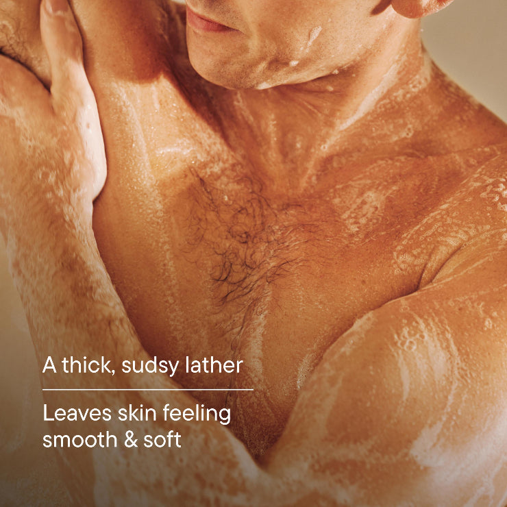 Close-up of a person with soap suds on their skin, highlighting a smooth and soft texture.