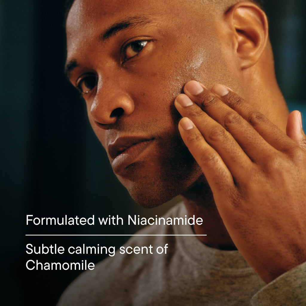 Man touching his face with text about niacinamide and chamomile scent