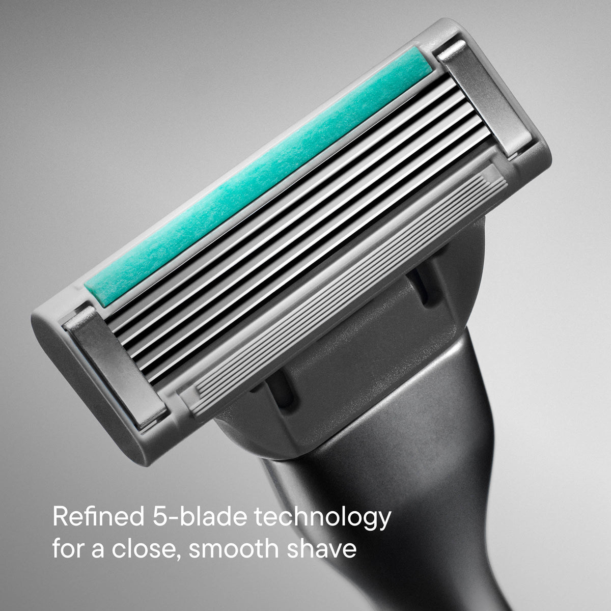 Shaving razor with five blades on a gray background