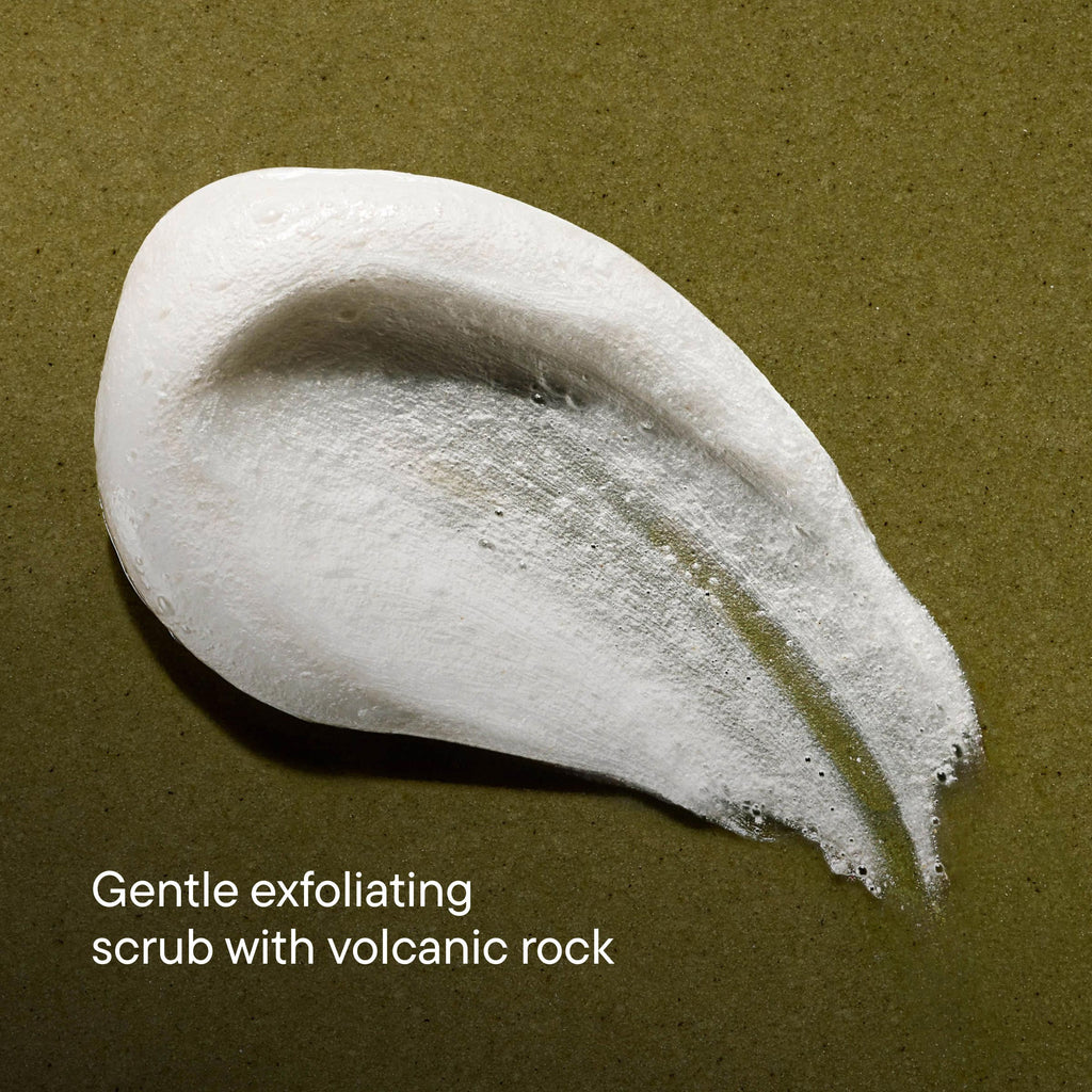White exfoliating scrub with volcanic rock on a brown background