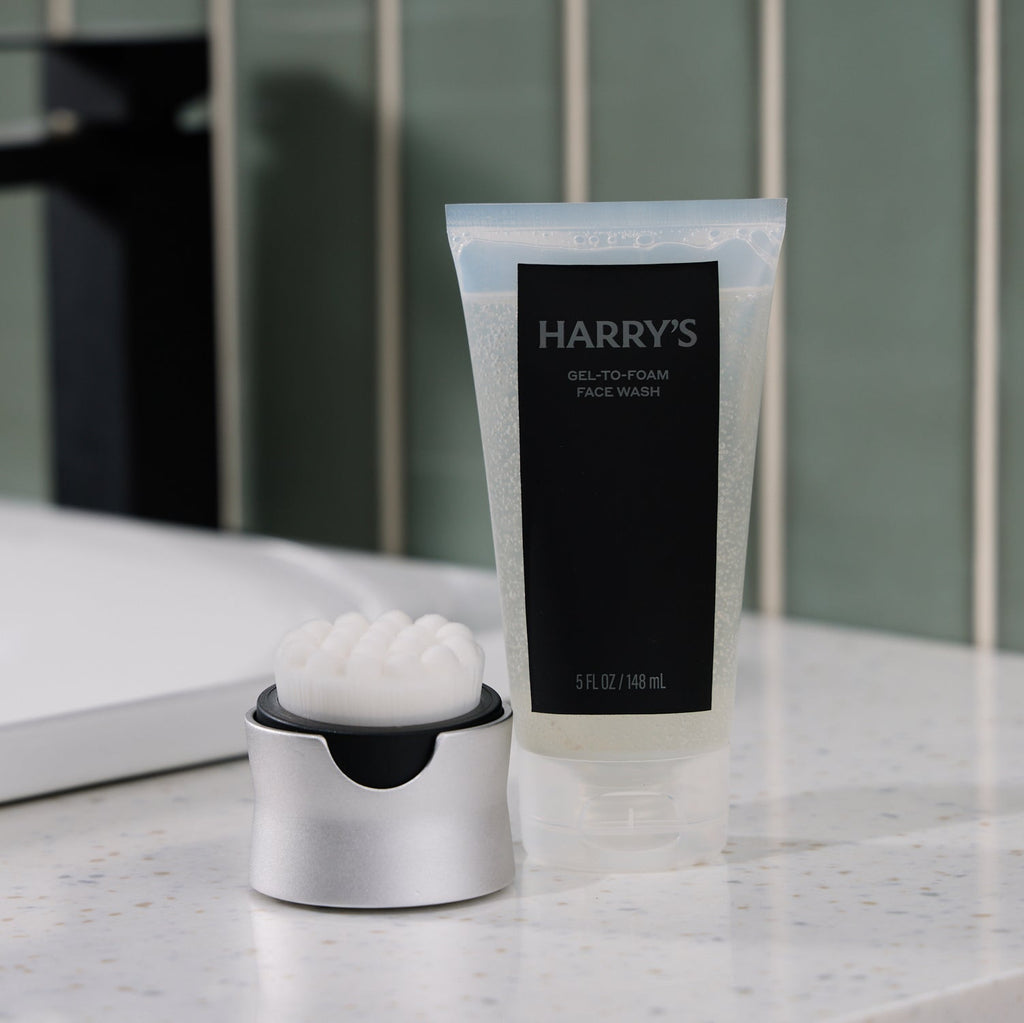 Tube of Harry's gel-to-foam face wash on a bathroom counter
