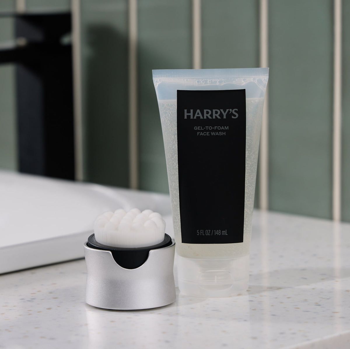 Tube of Harry's gel-to-foam face wash on a bathroom counter
