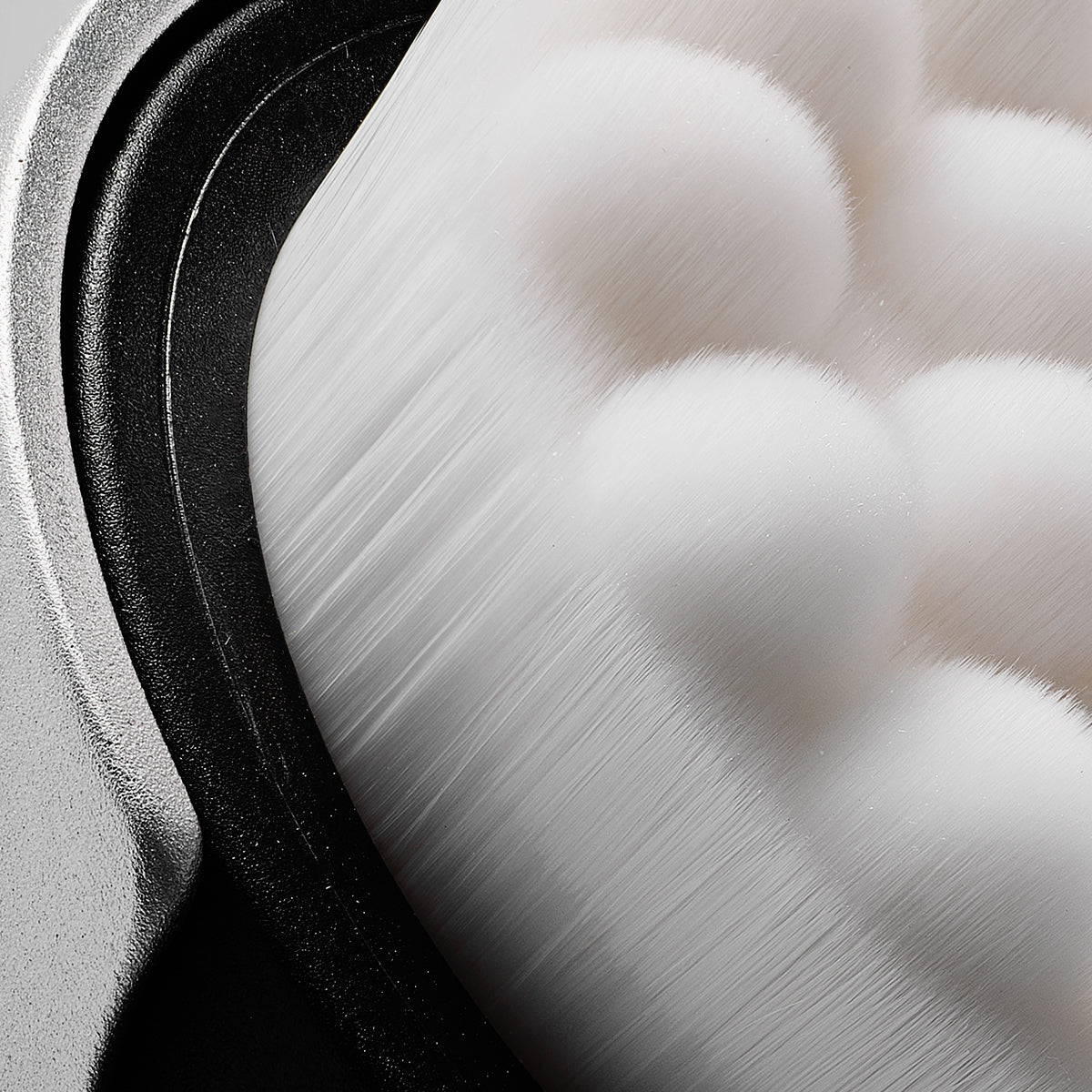 Close-up of a textured facial brush with a focus on material and texture.