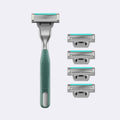 Men's grooming kit with a green razor and four razor heads on a light gray background