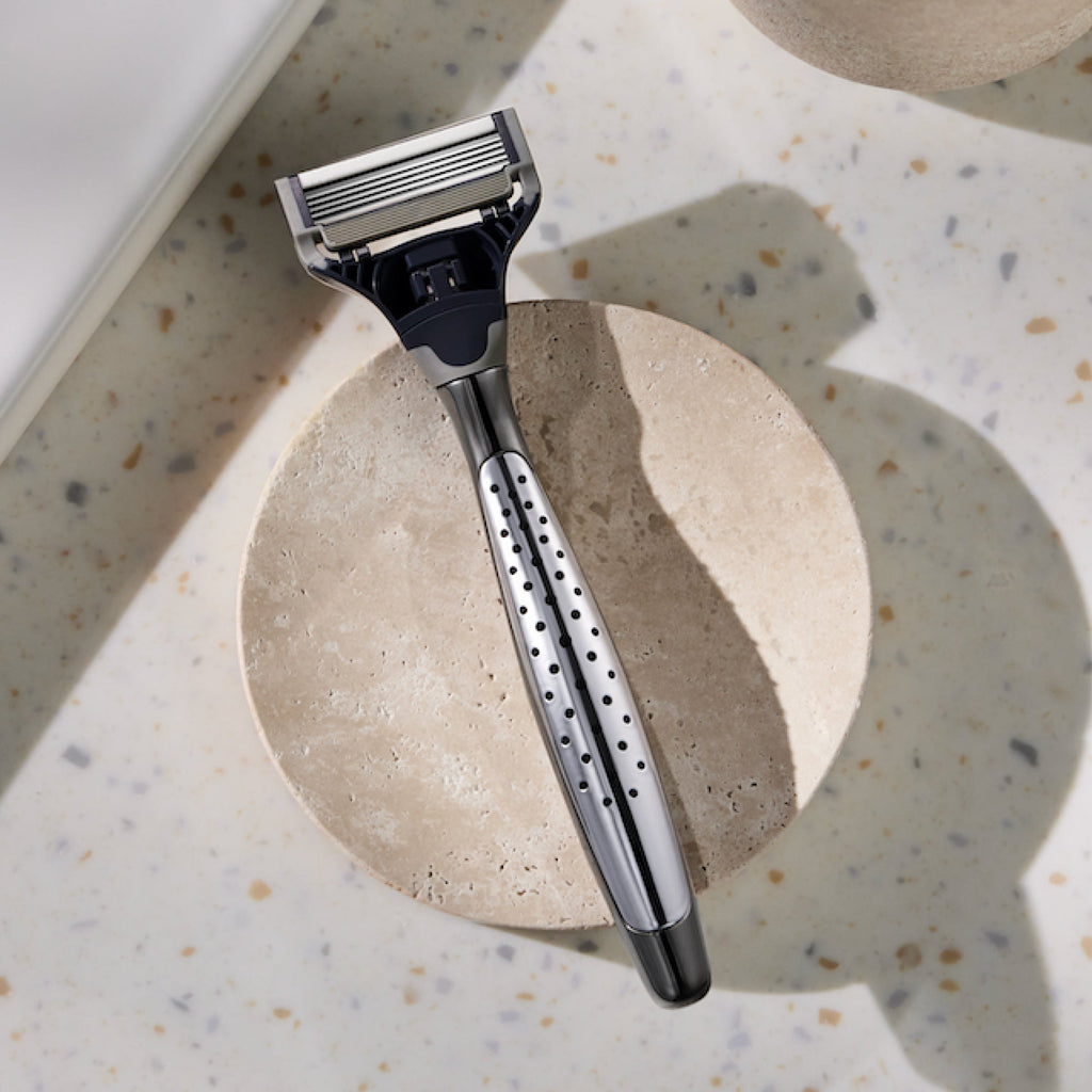 Craft razor on a white stone countertop.