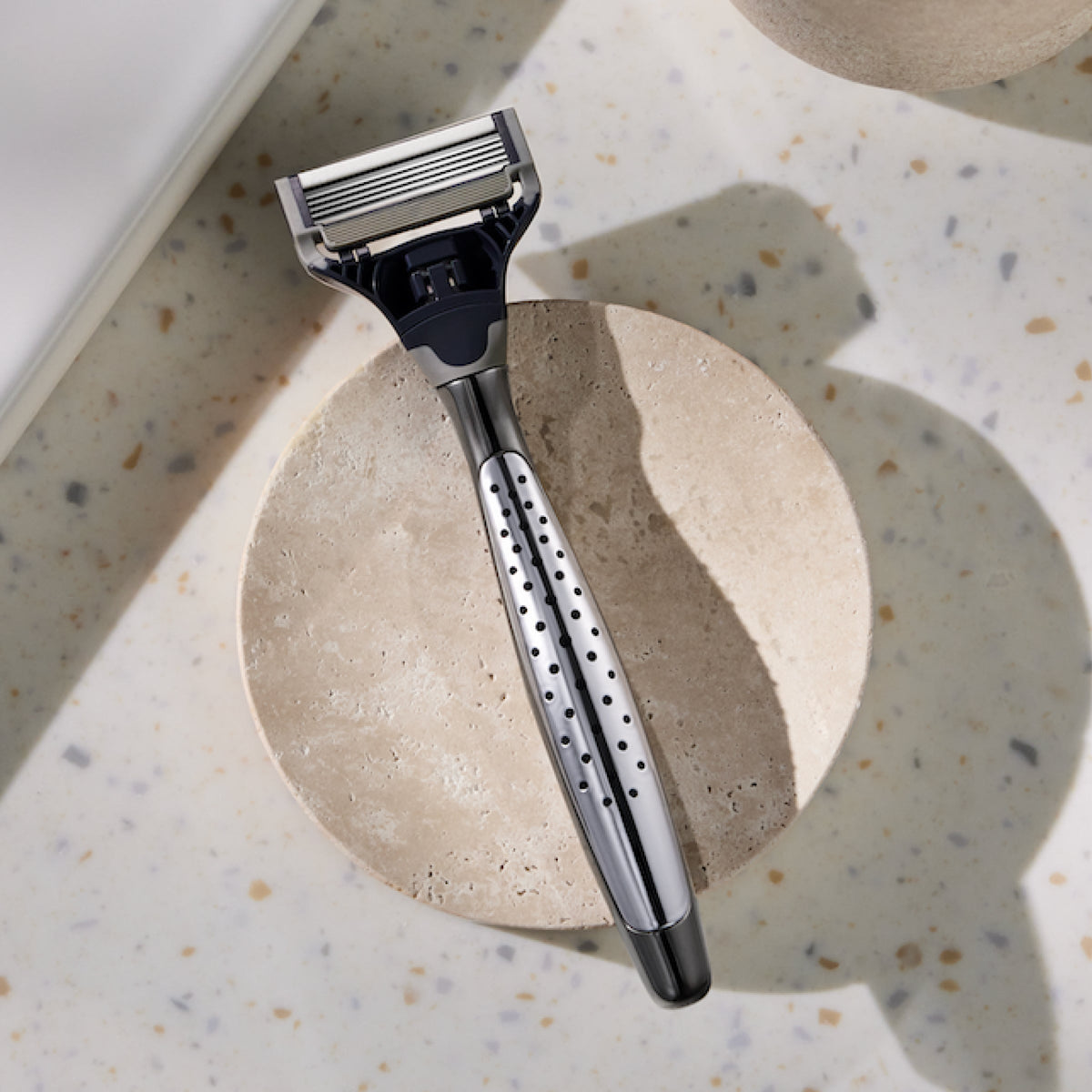 Craft razor on a white stone countertop.