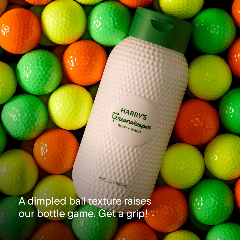 Bottle of 'Harry's Greenkeeper' body wash surrounded by colorful golf balls