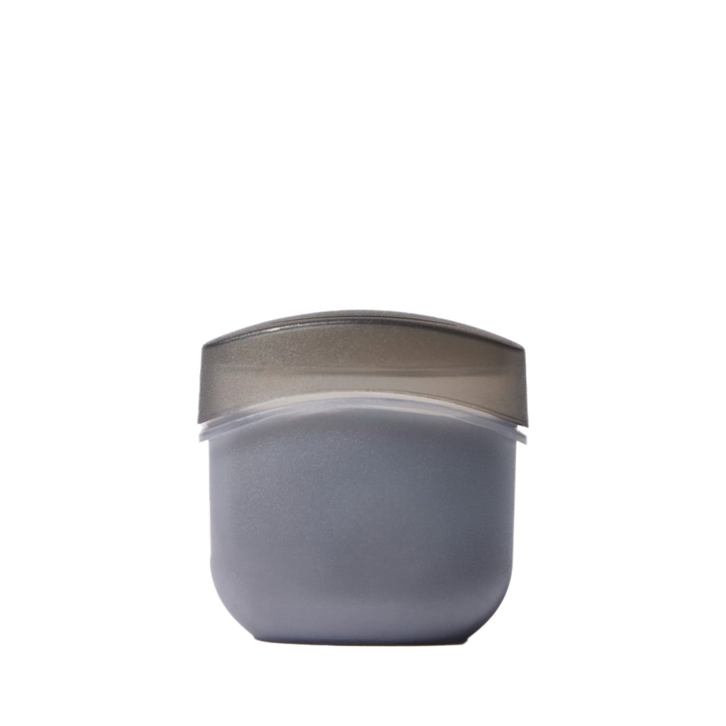 Gray container with a metallic lid on a white background