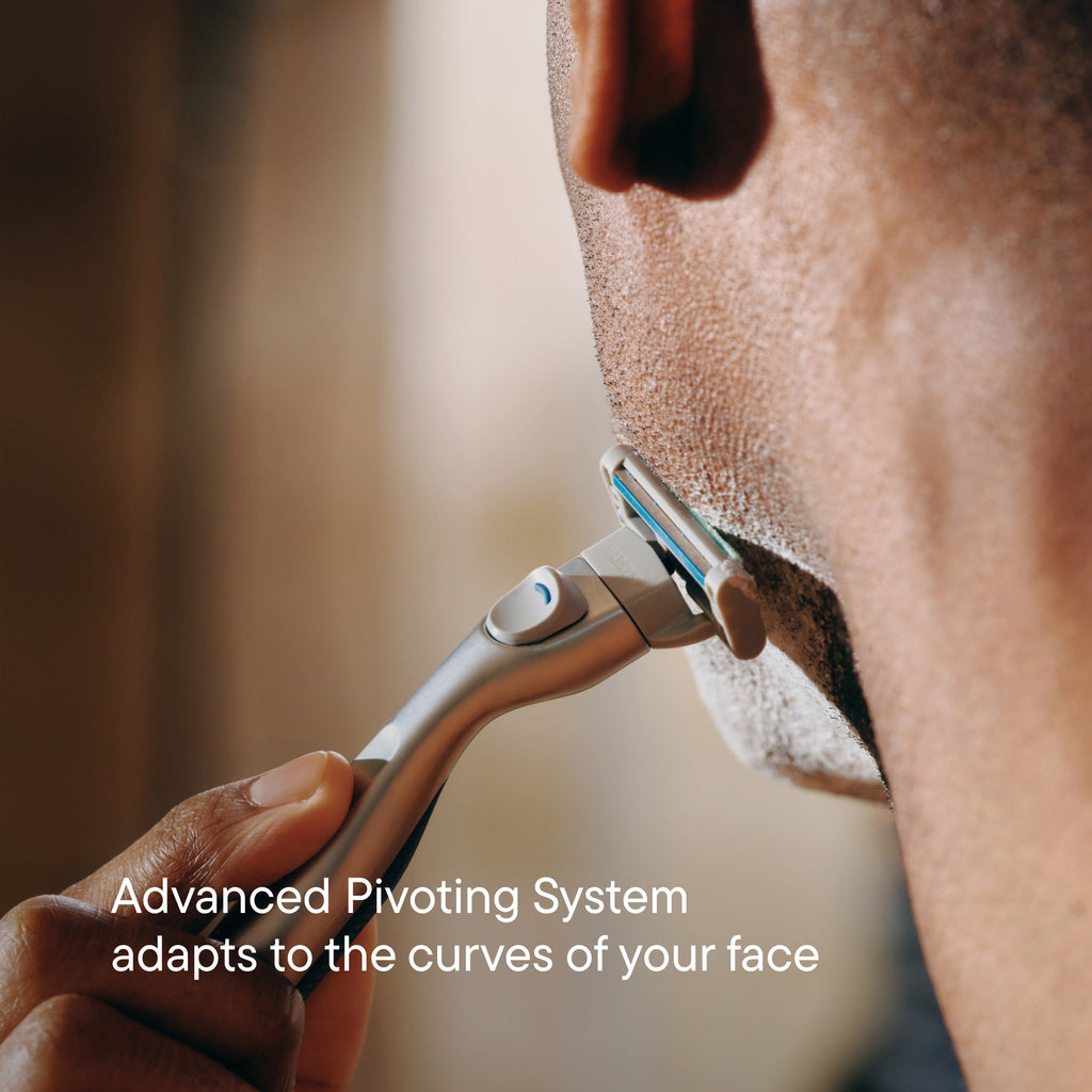 Person using a razor on their face with text about an advanced pivoting system.