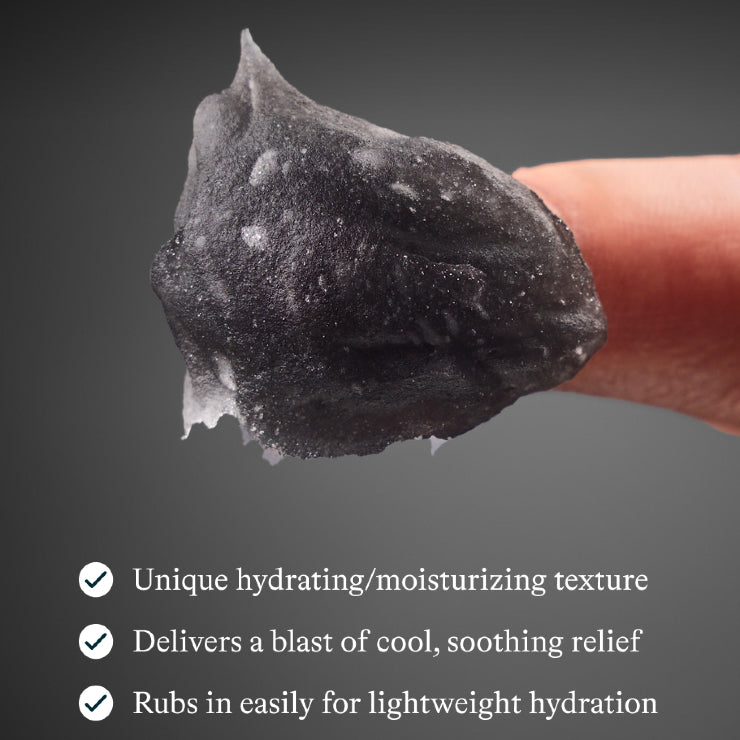 Black hydrating cream being held between fingers with product benefits listed below.