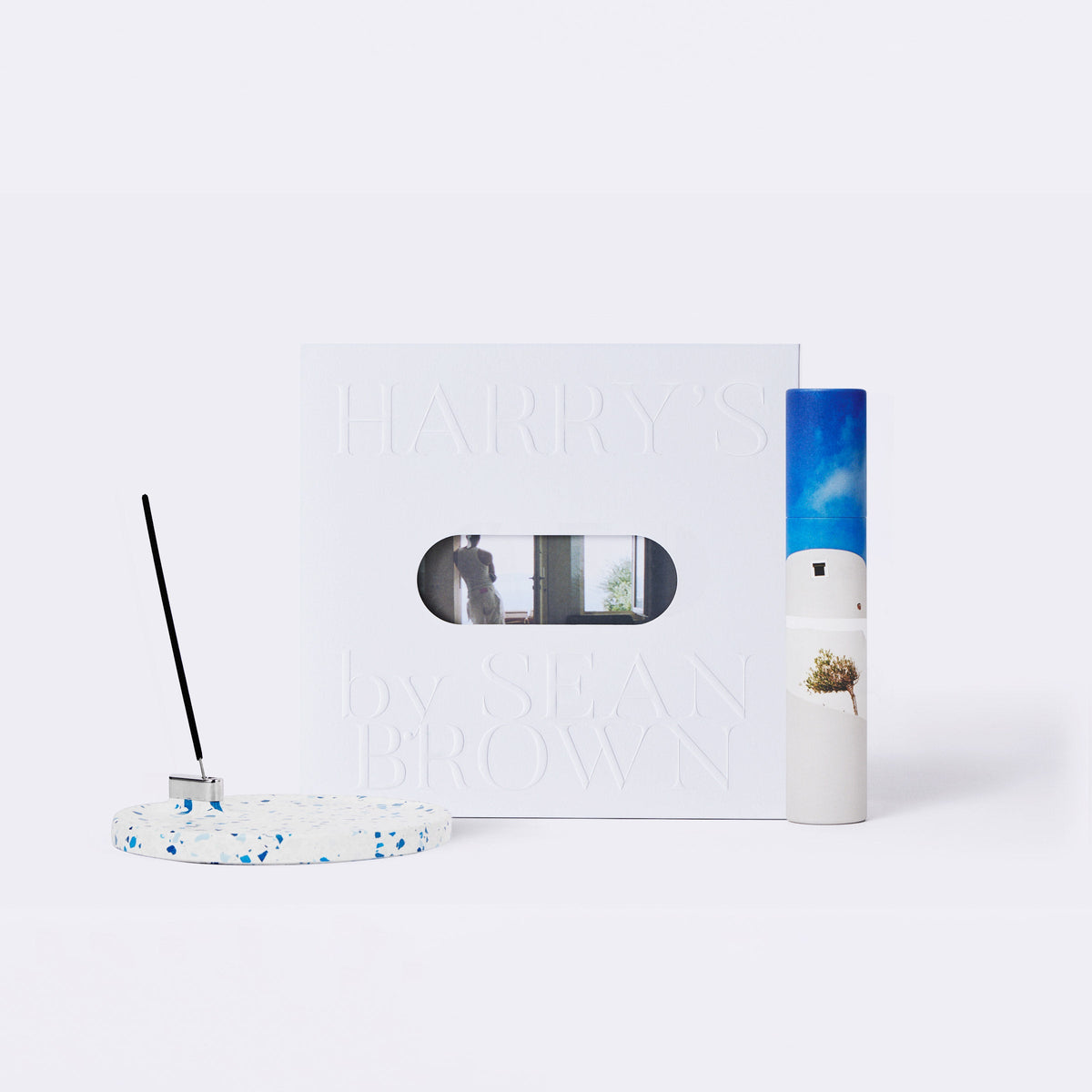 Terrazzo Incense Holder, white box packaging and Incense Sticks packaged in a paper tube printed with Mediterranean imagery. 