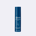 Blue bottle of Harry's beard conditioning spray on a light blue background