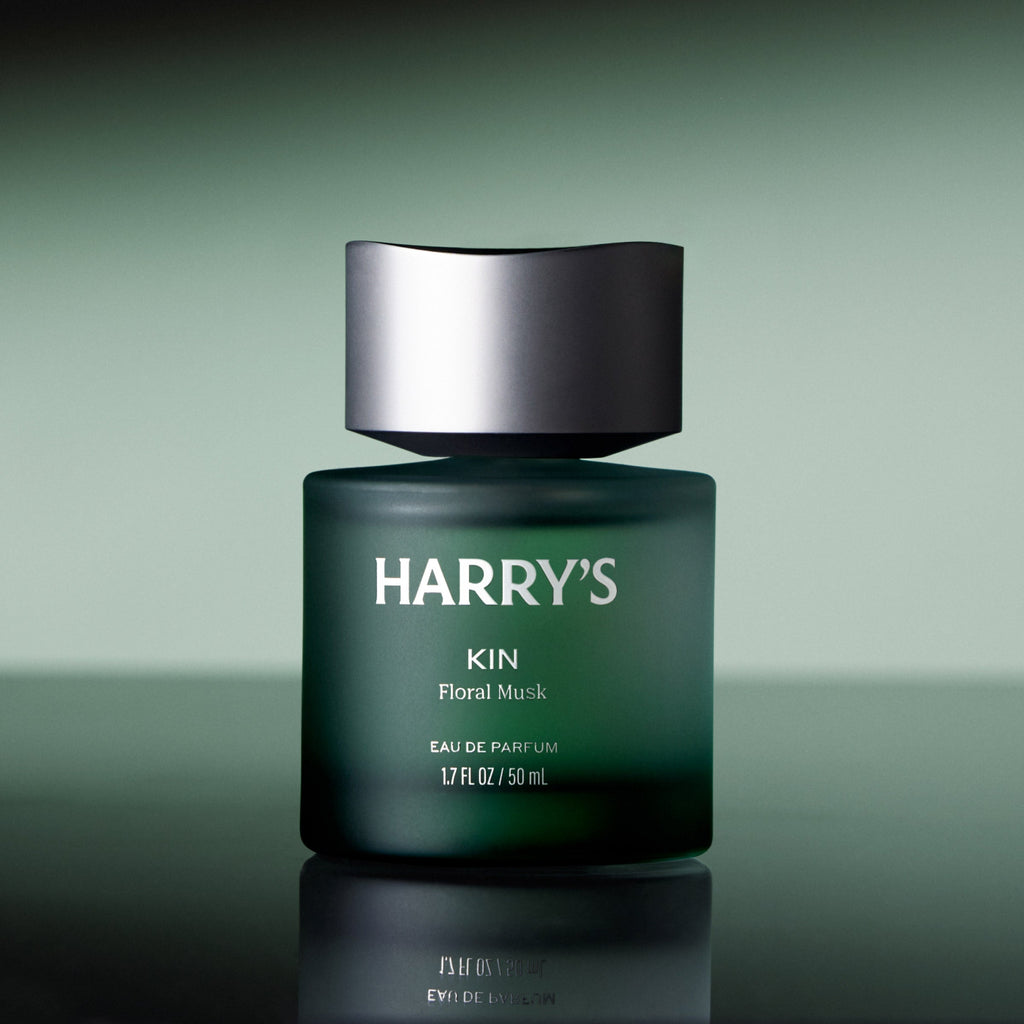 Green cologne bottle with silver cap labeled 'HARRY'S' on a green background