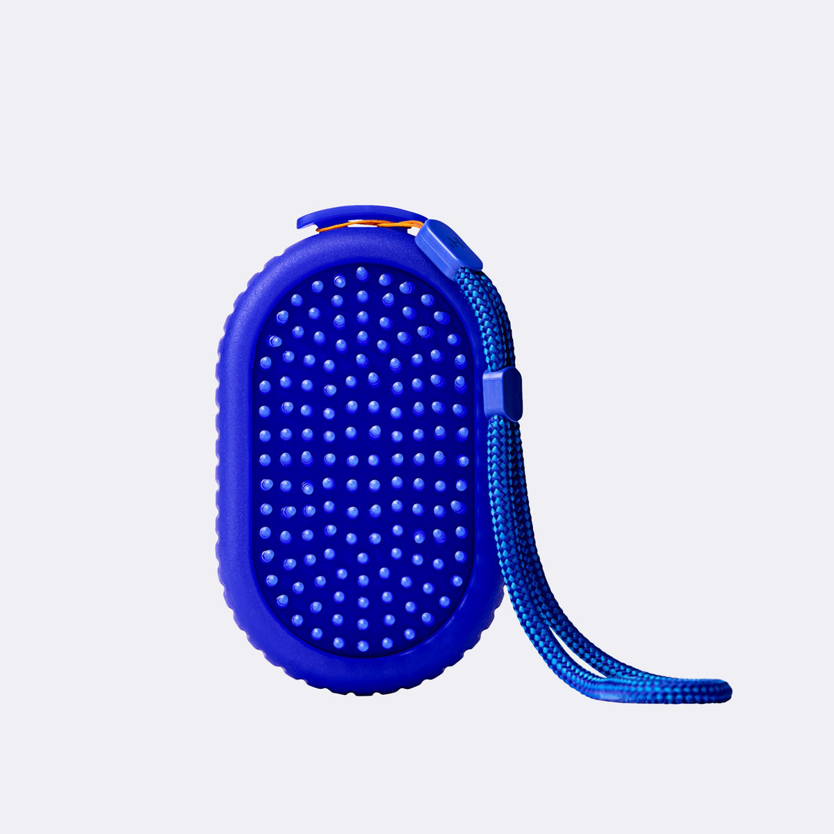 Blue textured scrubber with a cord on a light gray background