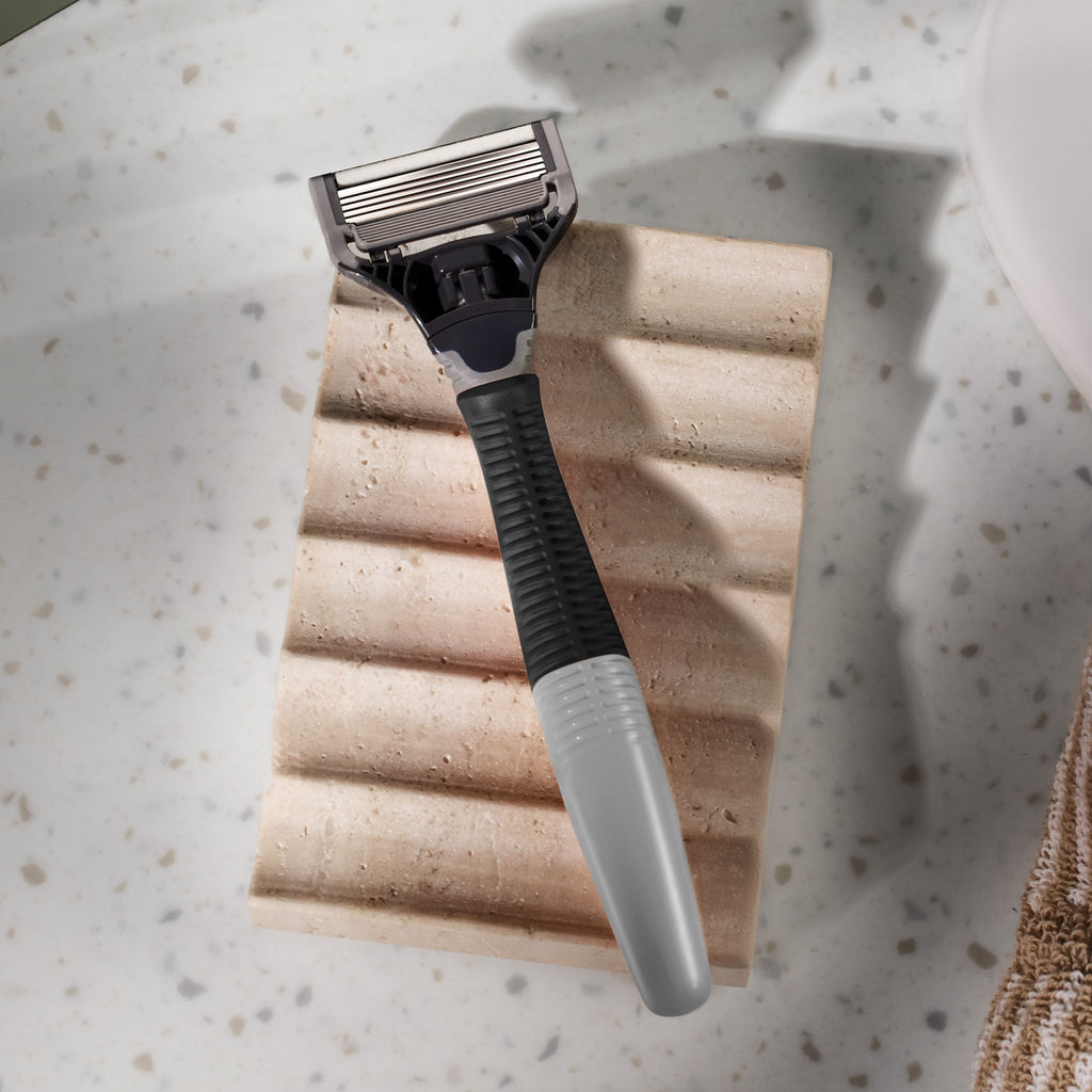 Shaving razor on a textured surface