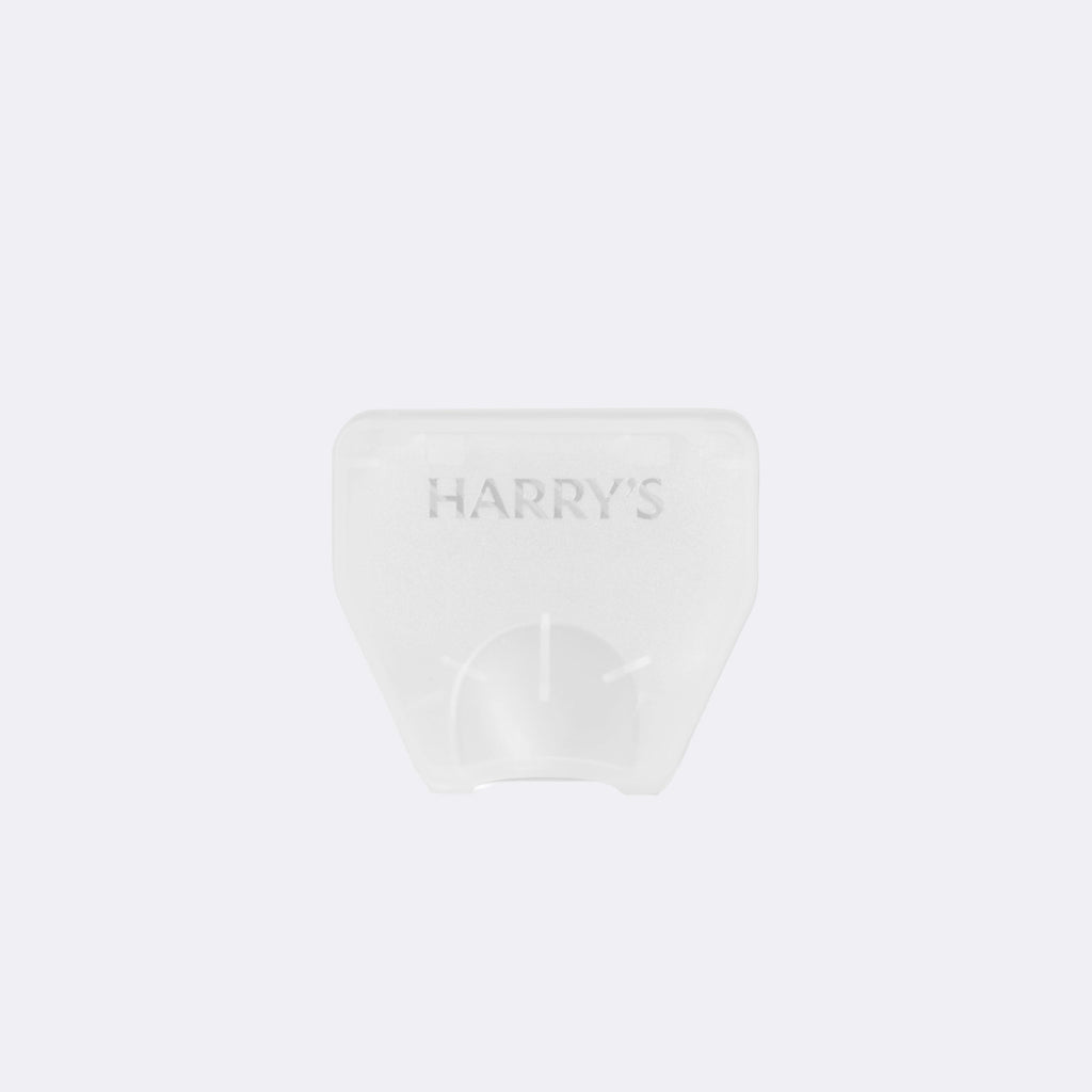 White razor blade cover with 'HARRY'S' branding on a white background