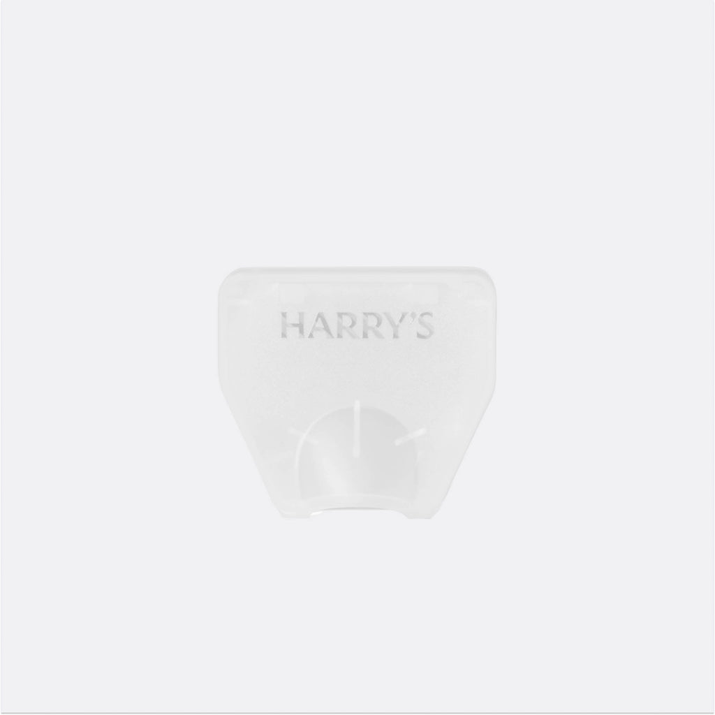 Clear plastic container with 'HARRY'S' branding on a white background