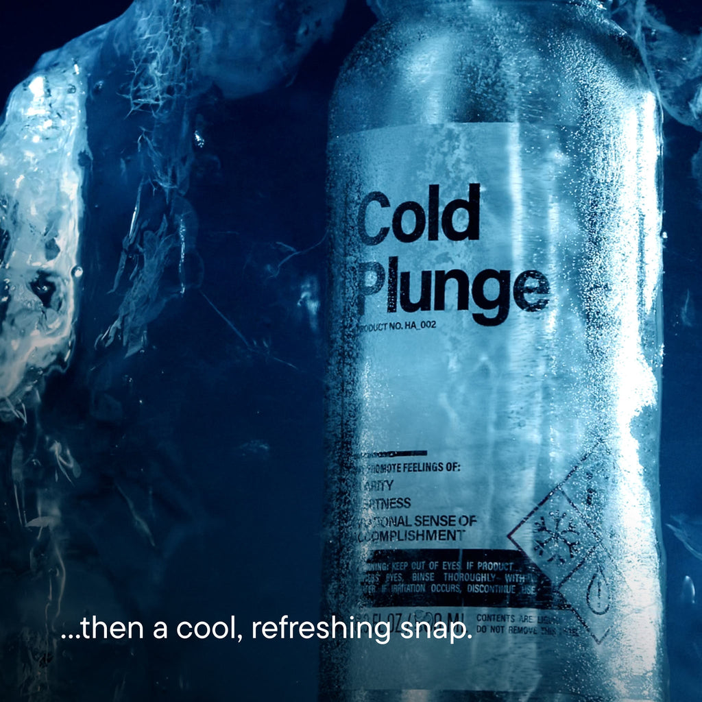 Bottle of 'Cold Plunge' with ice cubes around it, suggesting a refreshing product.