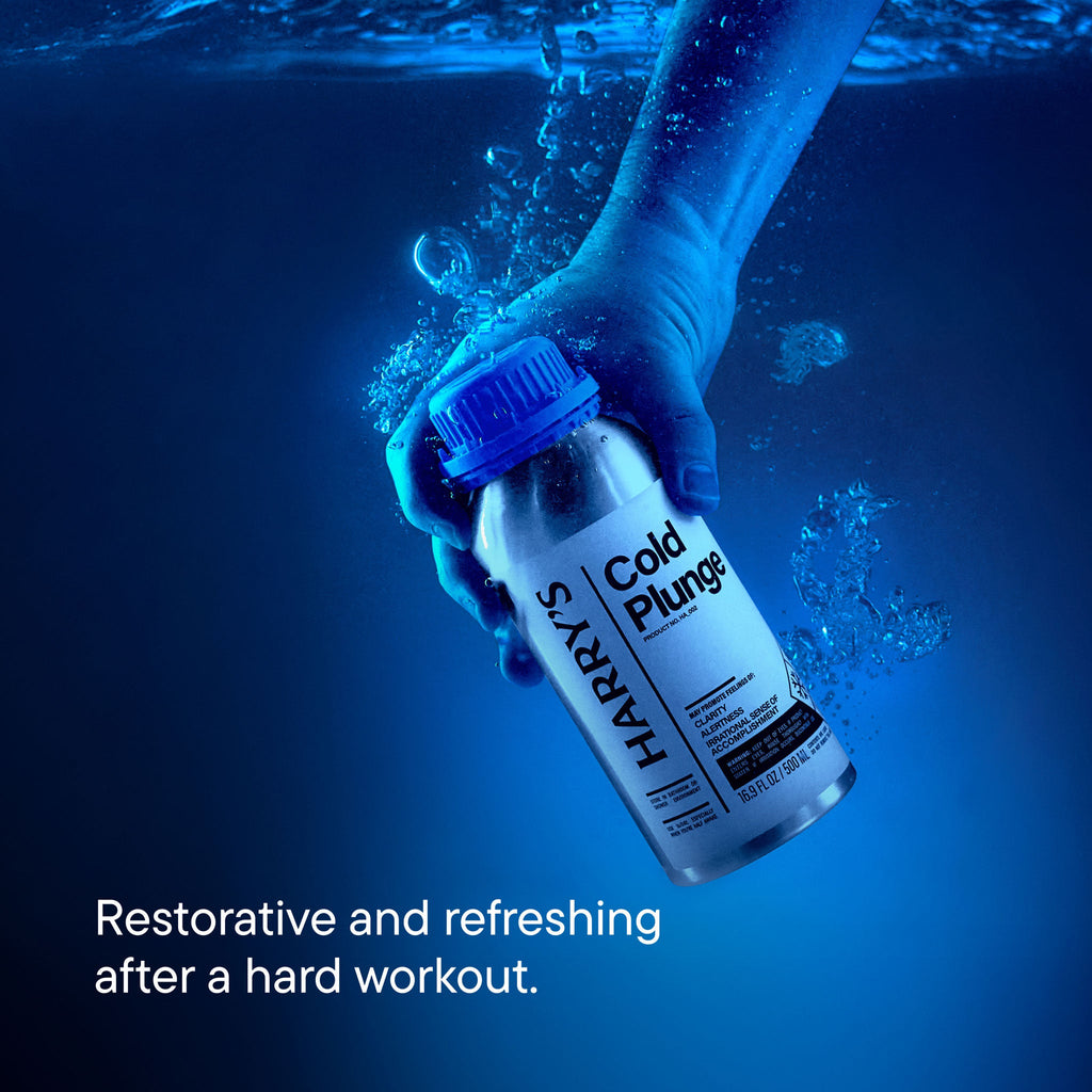 Hand holding a bottle of Harry's Cold Plunge under water with promotional text.